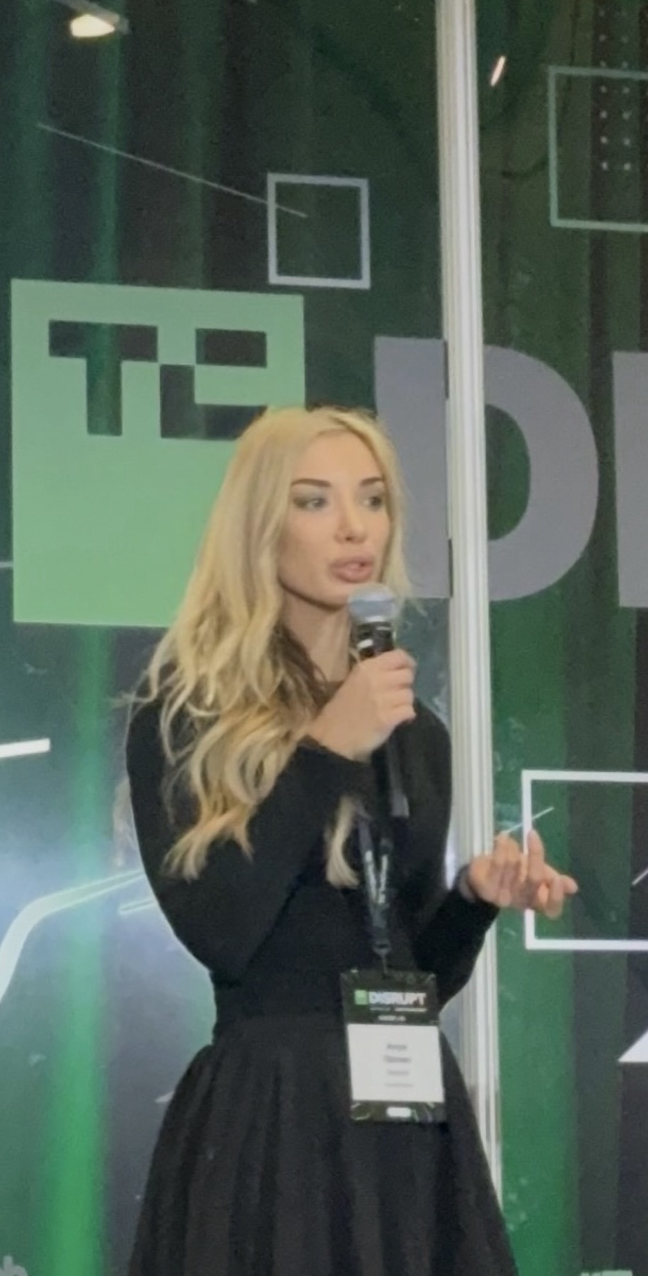 Redvest founder Anya Ozmen presenting the stock market game on stage at TechCrunch Disrupt