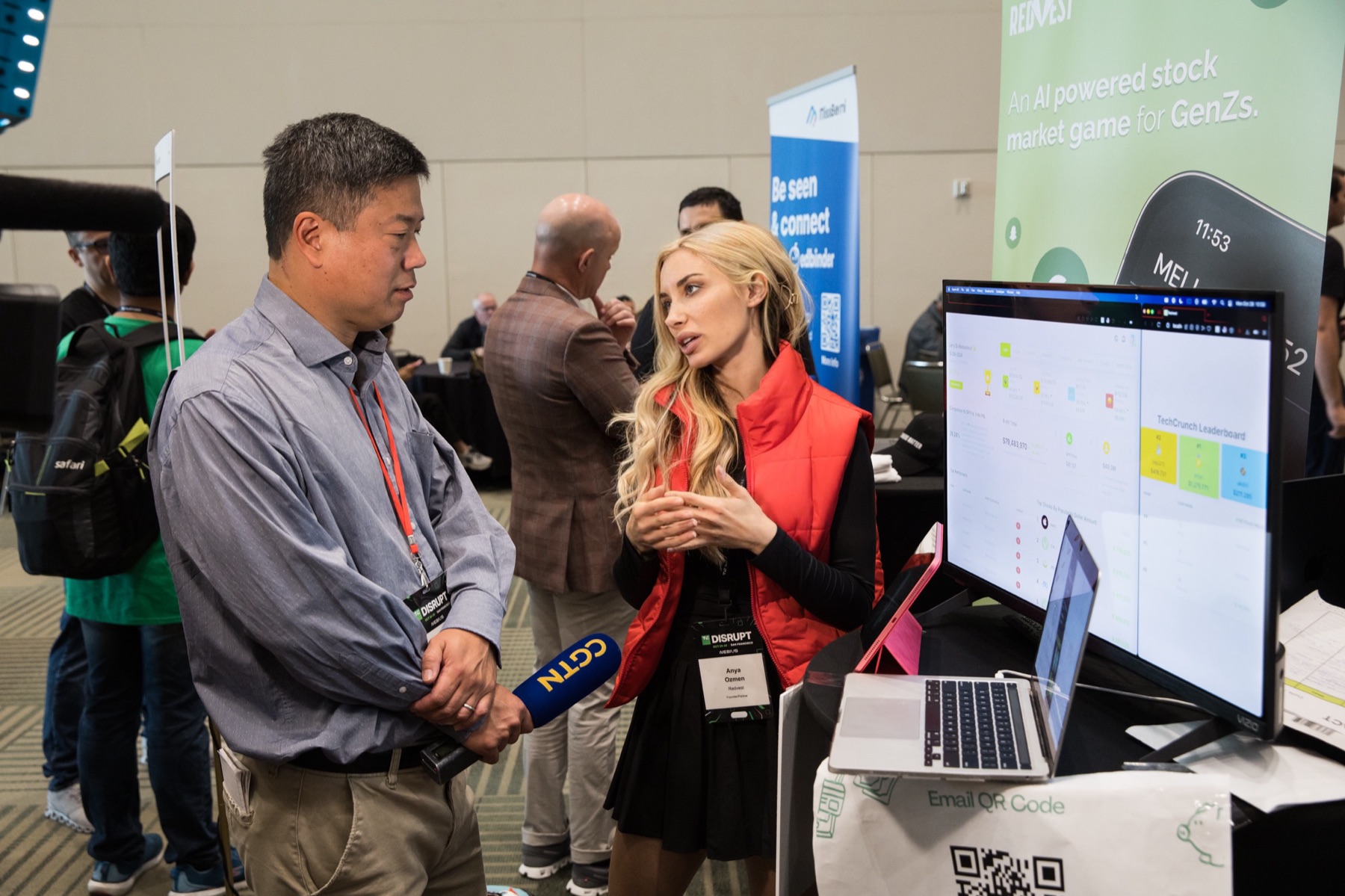 Anya Ozmen describing Redvest's virtual investing dashboard during a news interview
