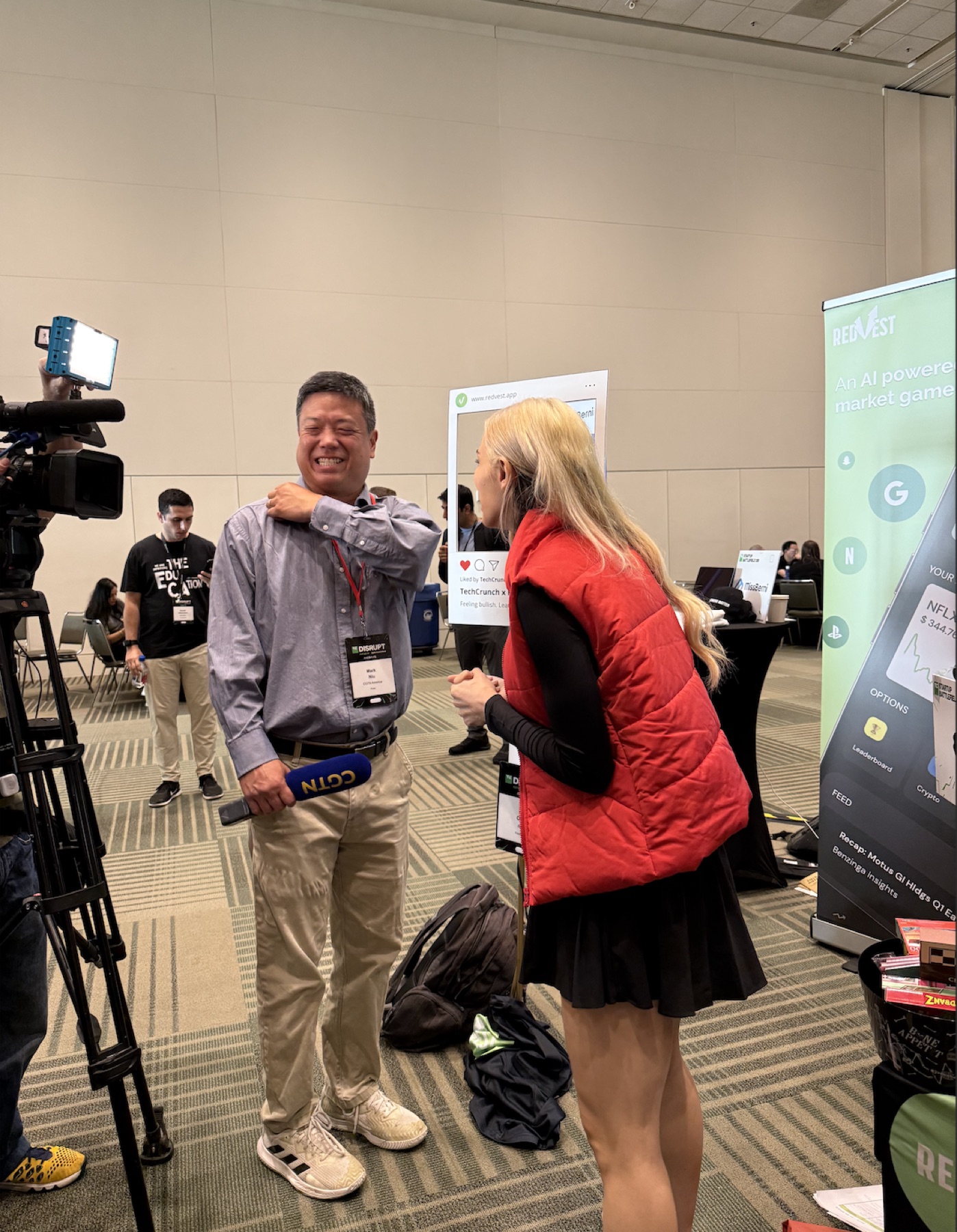 Anya Ozmen speaking with a reporter during a Redvest interview at TechCrunch Disrupt